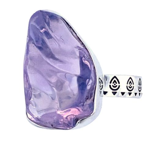 Stunning solitaire Lavender Amethyst gemstone set into a high polish sterling silver band with embossing. 