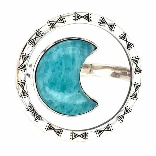 A bright blue Amazonite is carved into a crescent moon and surrounded by a halo of artisan engraved sterling silver.
