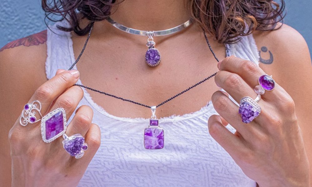 Woman wearing rings with purple stones