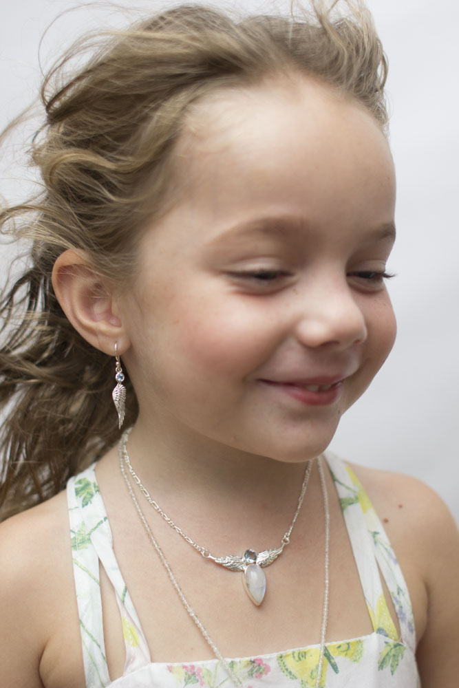 Young girl wearing a silver necklace